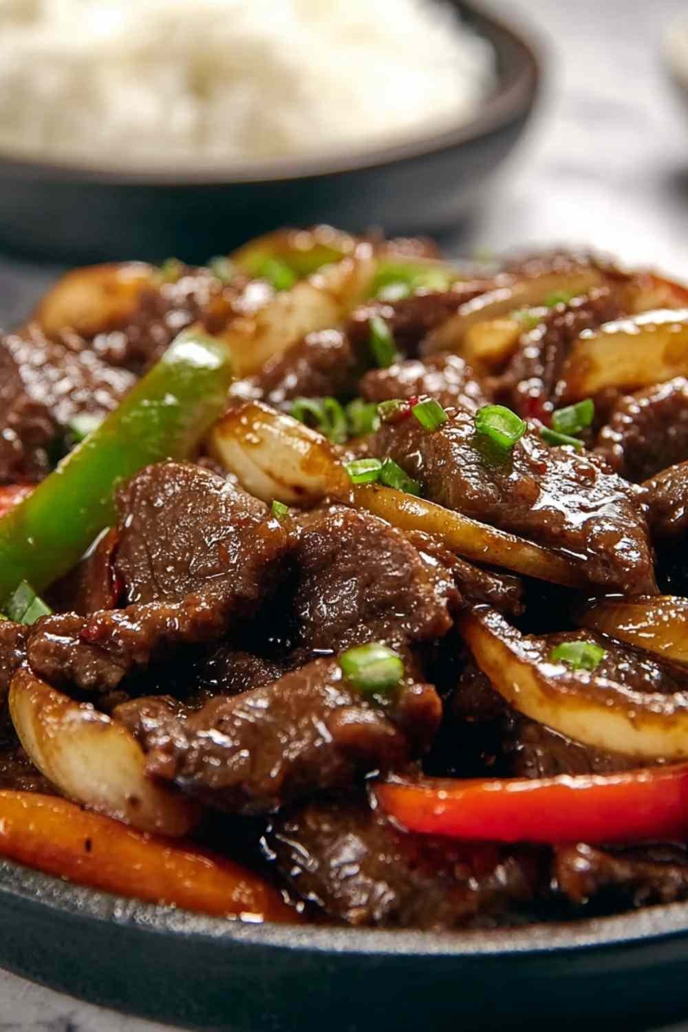 Chinese Pepper Steak with Onions served over rice.