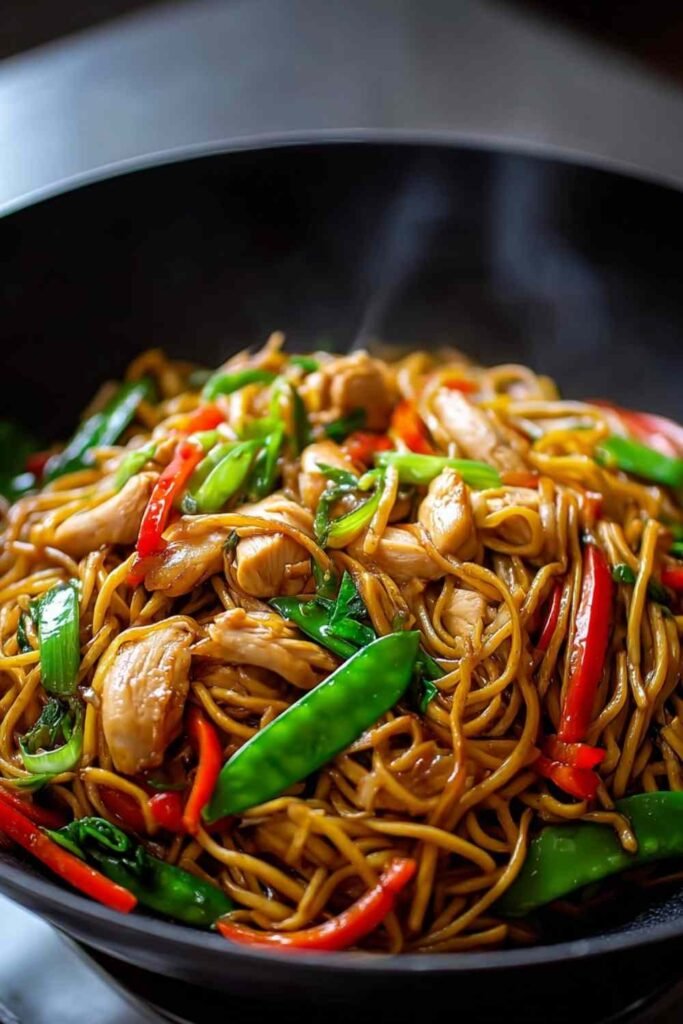 Chicken Lo Mein Recipe plated with chopsticks