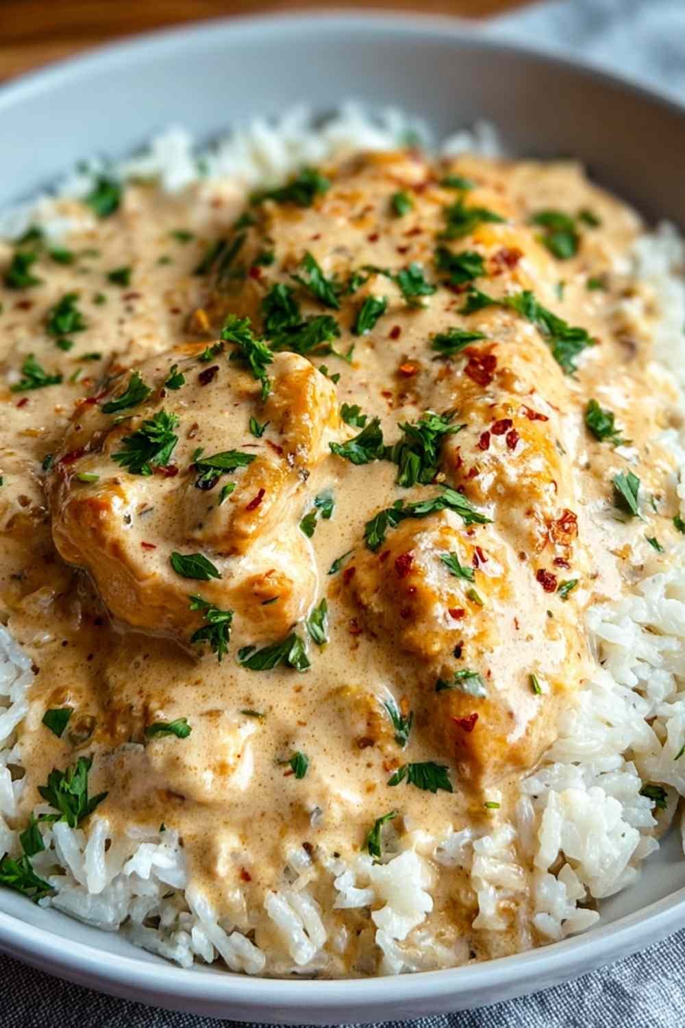 Homemade Creamy Smothered Chicken and Rice with melted cheese sauce