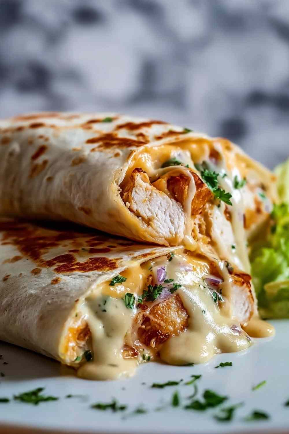Finished Cheesy Garlic Chicken Wraps on Plate.