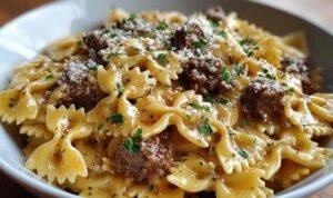 Creamy Parmesan Garlic Beef Bowtie Pasta in cast iron skillet