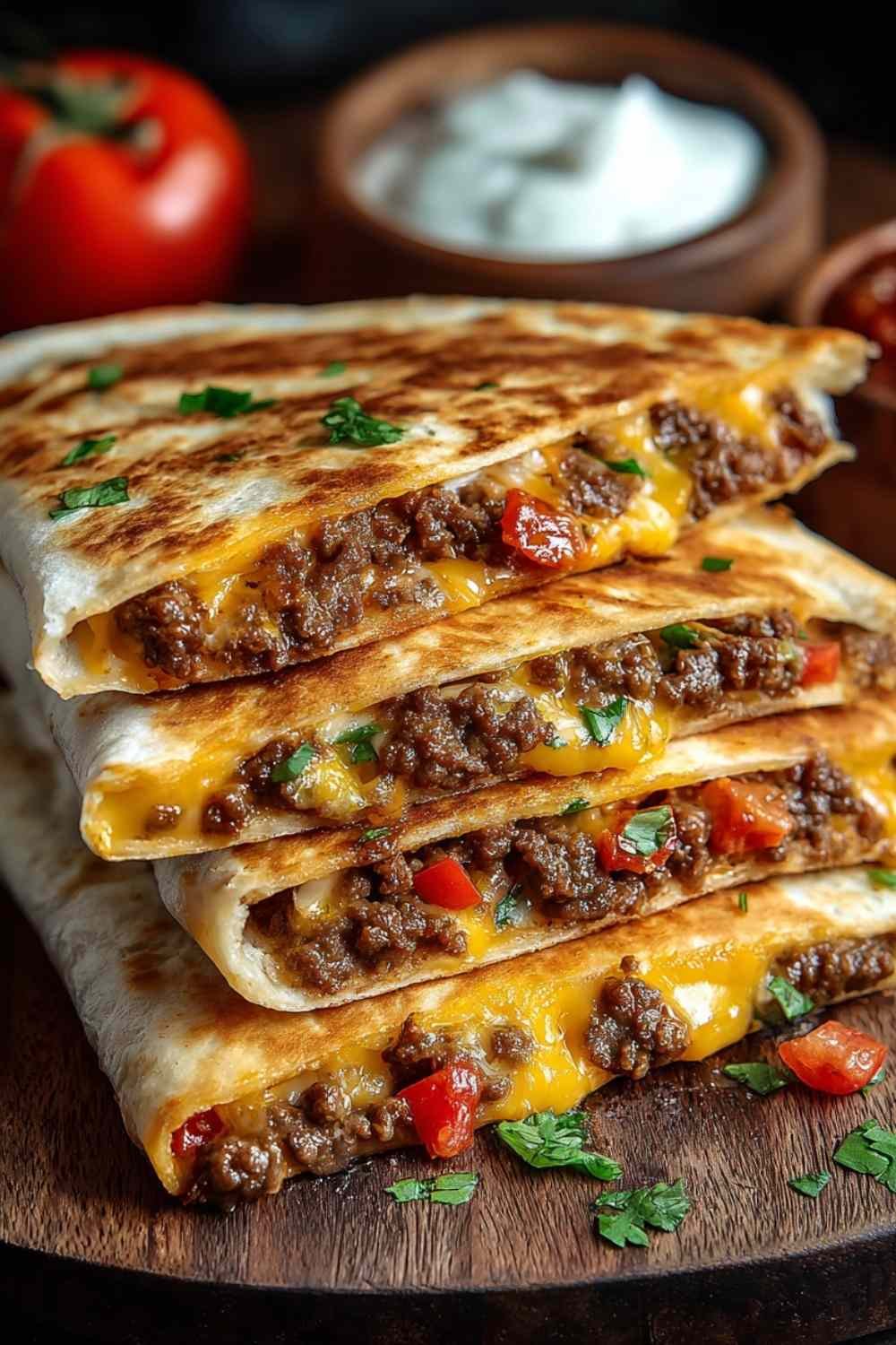 Golden crispy smashburger quesadillas sliced into wedges showing melted cheese and seasoned beef filling
