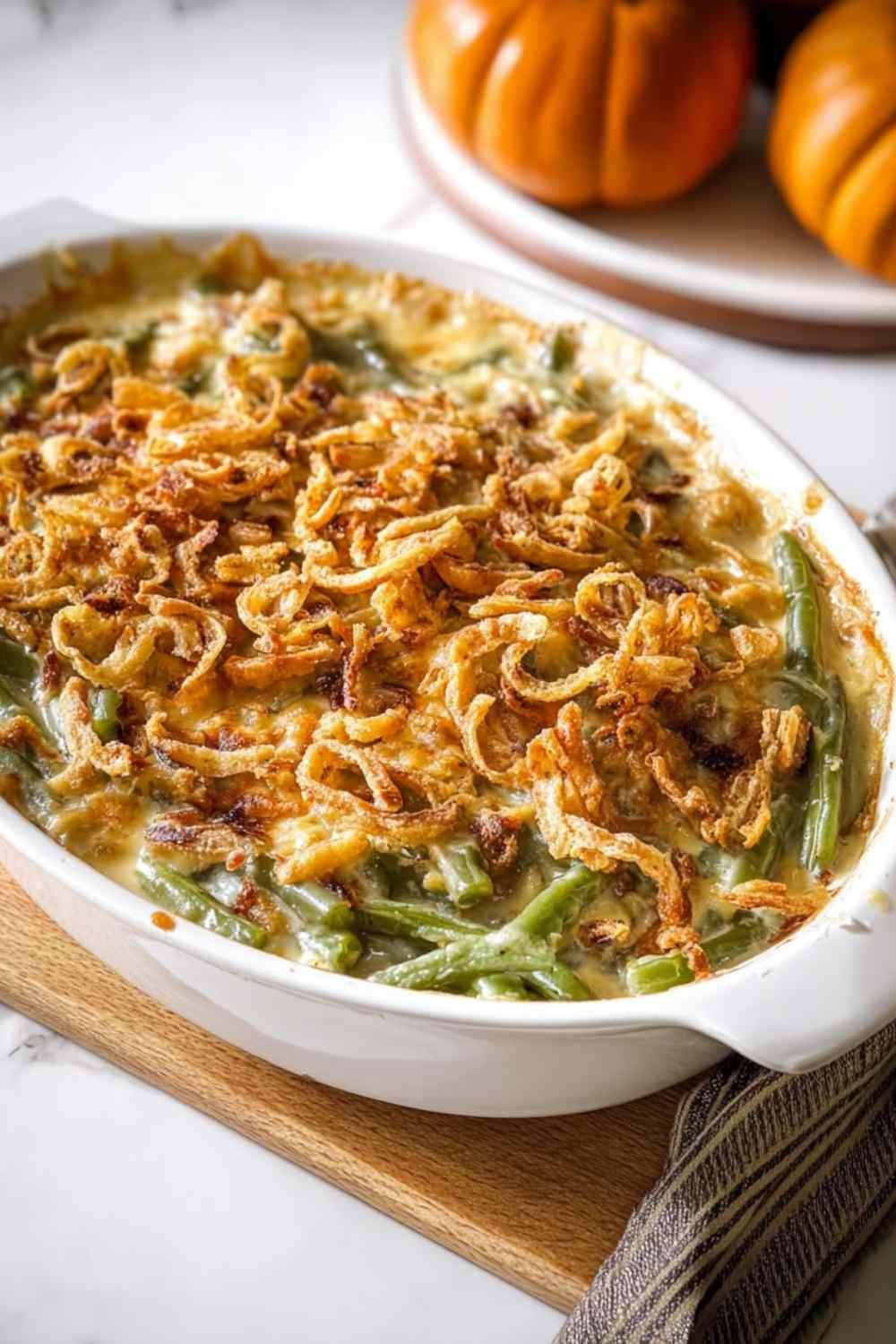Green bean casserole mixture in casserole dish ready to bake with creamy sauce