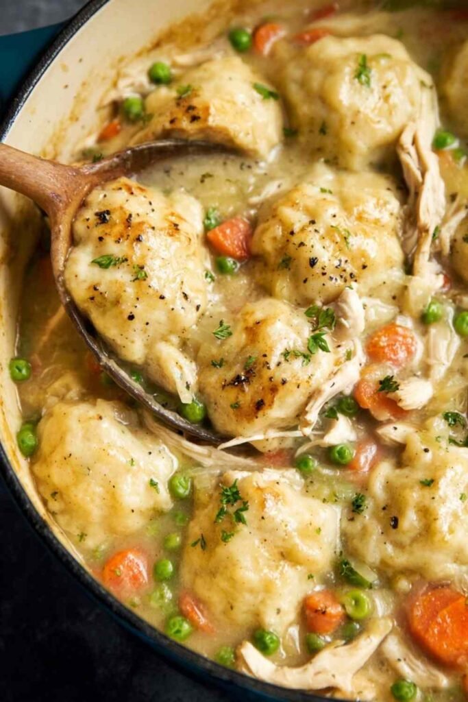Easy Chicken and Dumplings in a creamy broth with fluffy dumplings