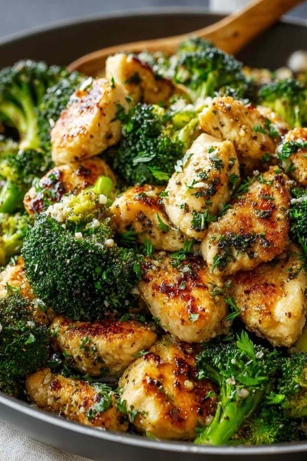 Garlic butter chicken broccoli in skillet with golden chicken pieces and bright green broccoli coated in silky butter sauce