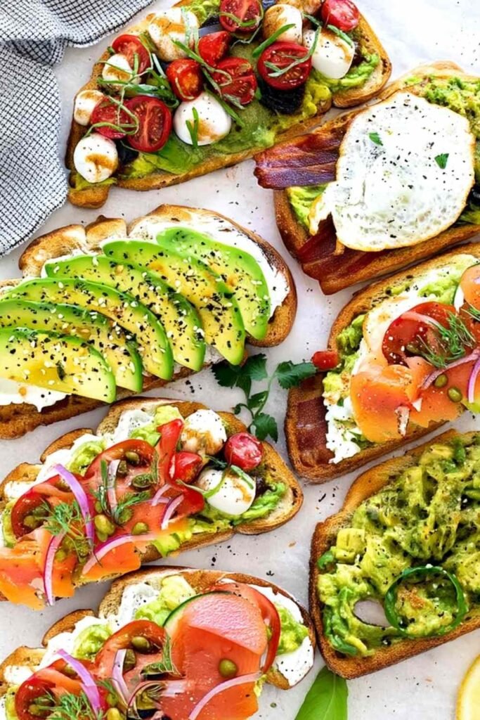 Simple avocado toast on toasted sourdough bread drizzled with olive oil and topped with fresh parsley