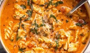 Marry Me Chicken Soup Creamy marry me chicken soup with rotini pasta, sun-dried tomatoes, and fresh basil garnished with parmesan cheese