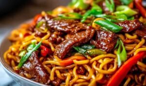 Sticky Beef Noodles Served in a Bowl with Sesame Garnish