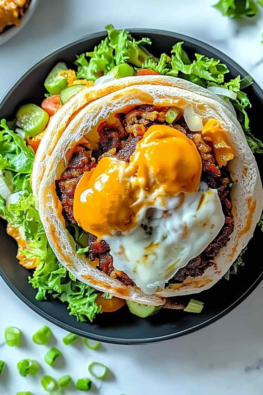 Big Mac Wraps sliced in half on a wooden board showing juicy seasoned ground beef, shredded lettuce, pickles, and melted cheese inside a golden toasted tortilla