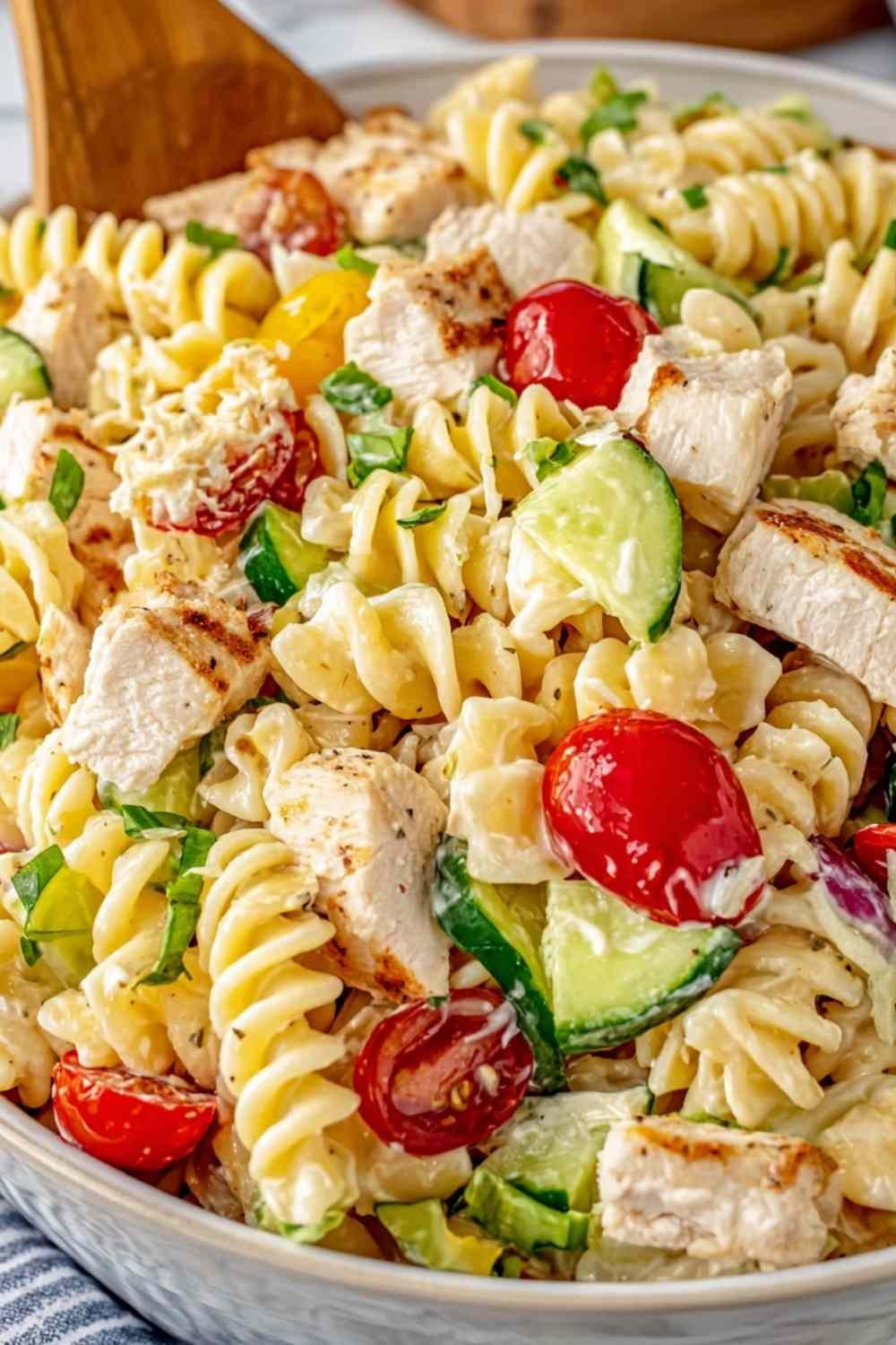 Chicken Club Pasta Salad with rotisserie chicken, crispy bacon, avocado, and cherry tomatoes in a creamy Italian-mayo dressing