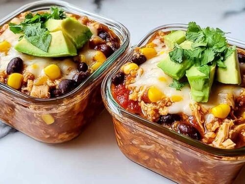 High-protein chicken cottage cheese enchilada bowl with melted cheese avocado cilantro and black beans