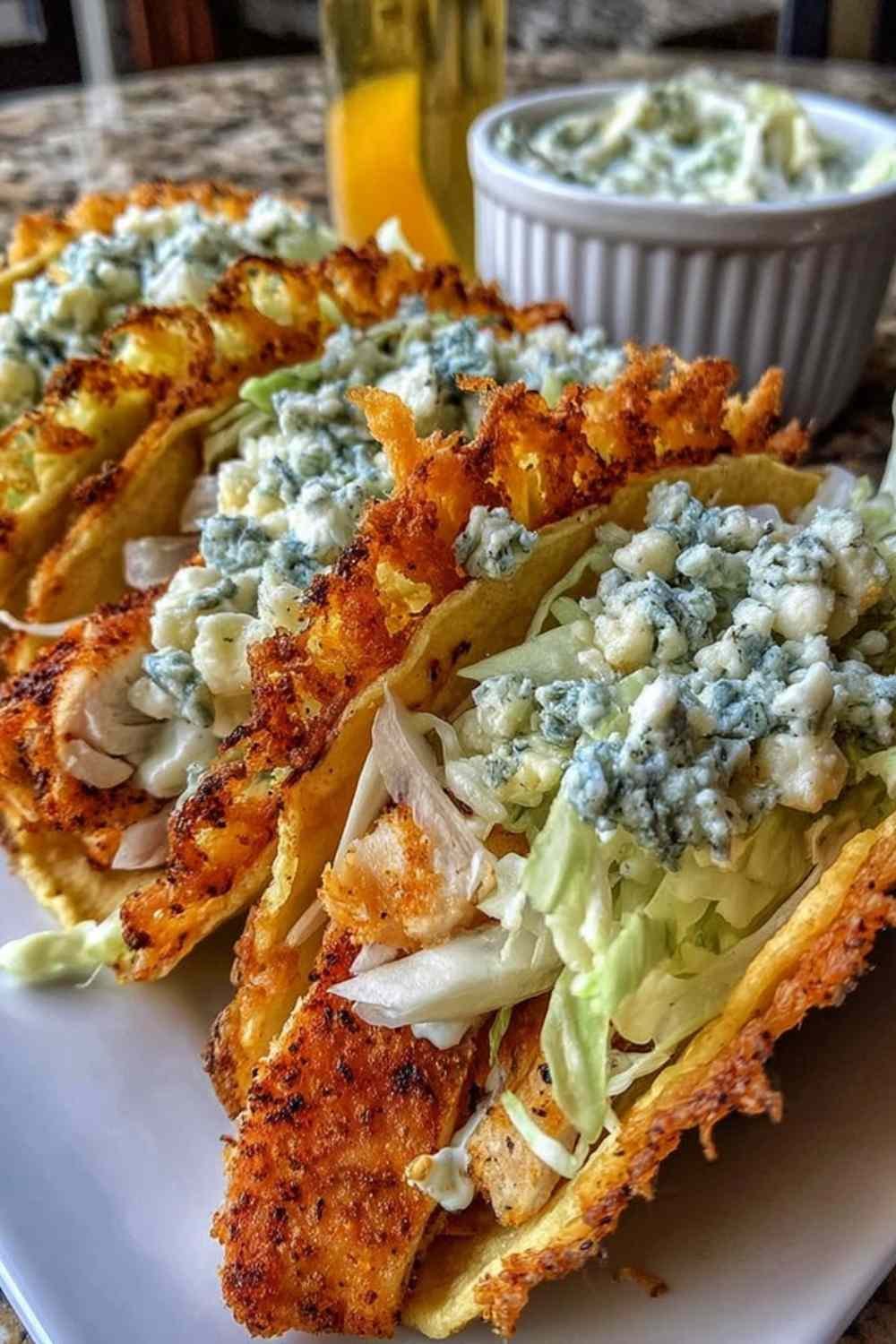 Dill Pickle Ranch Smash Chicken Tacos topped with creamy ranch cottage cheese and crispy cheese lace on a wooden serving board