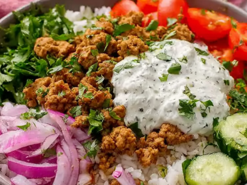 Mediterranean ground turkey bowls with jasmine rice cucumber tomatoes red onion parsley and lemon dill yogurt sauce overhead