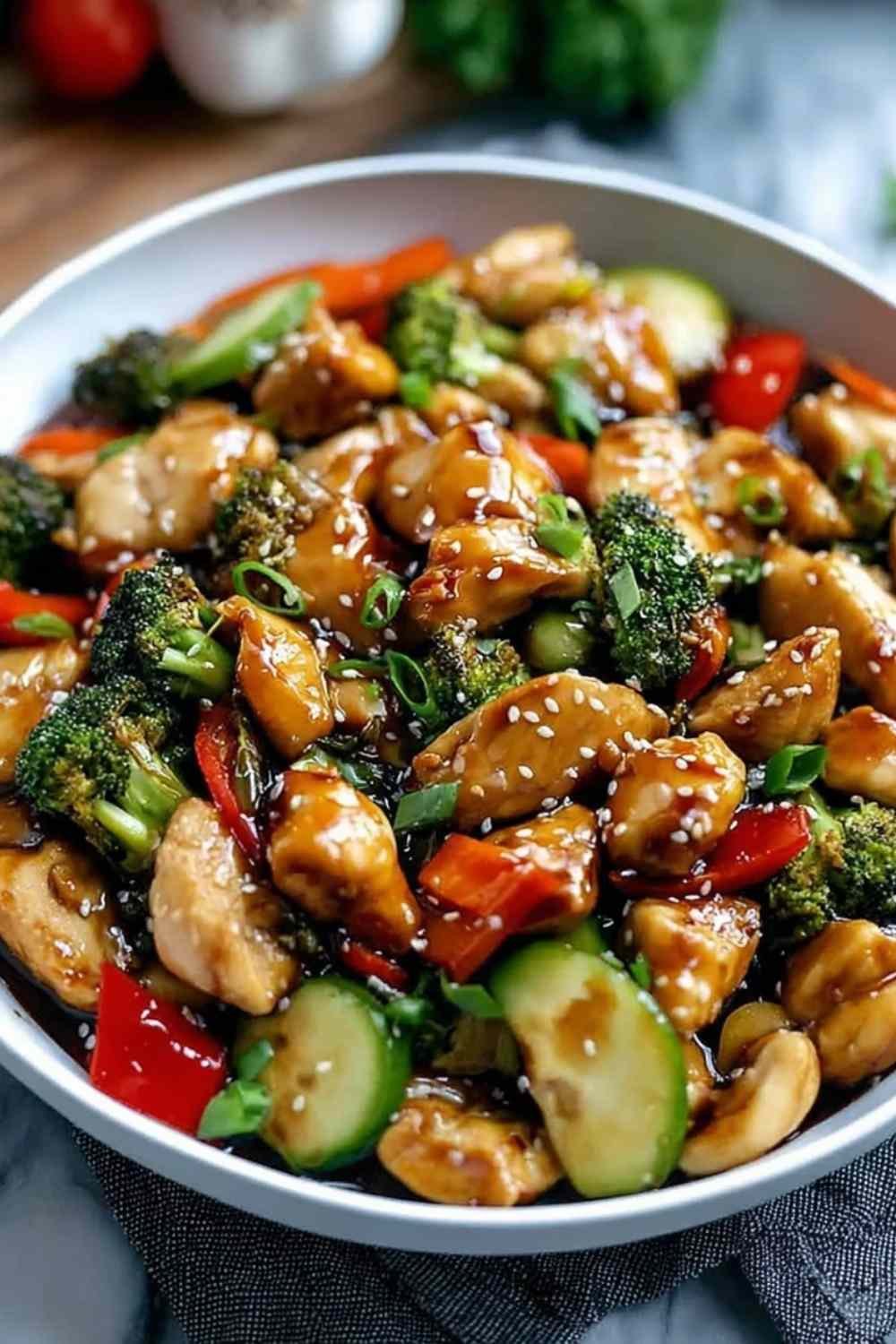 Honey Garlic Chicken Stir Fry with colorful vegetables in a cast iron skillet
