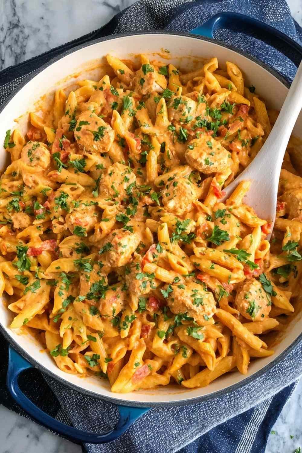 Creamy Southwest Chicken Alfredo with penne pasta and cheddar cheese in a skillet