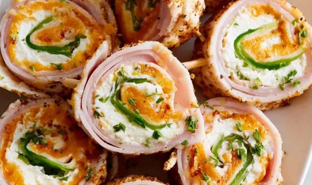 High protein bariatric chicken soup in a white bowl garnished with fresh parsley and a dollop of Greek yogurt