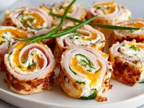 High protein bariatric chicken soup in a white bowl garnished with fresh parsley and a dollop of Greek yogurt